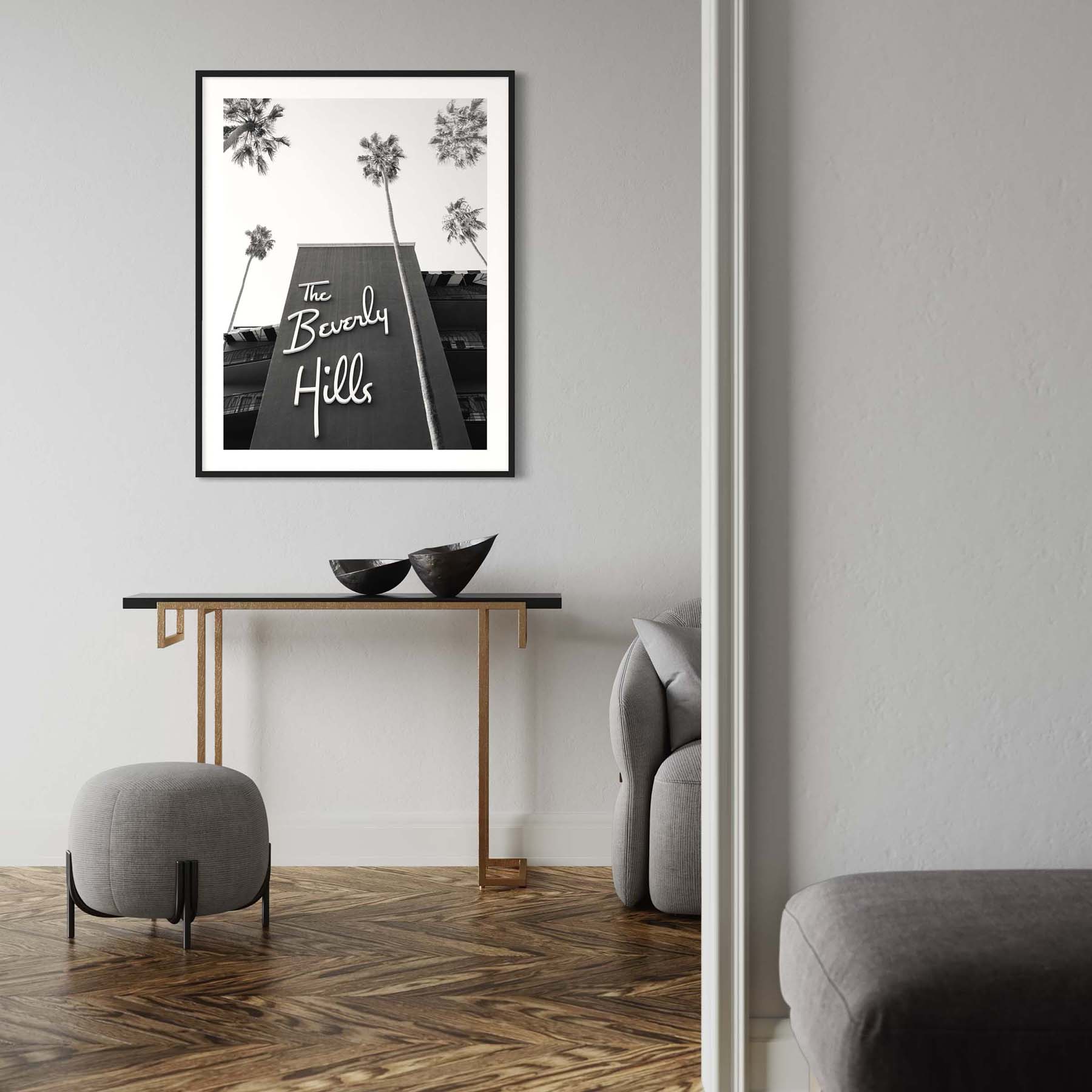A framed black and white photograph of the Beverly Hills Hotel hangs on the wall in a modern-themed entryway.