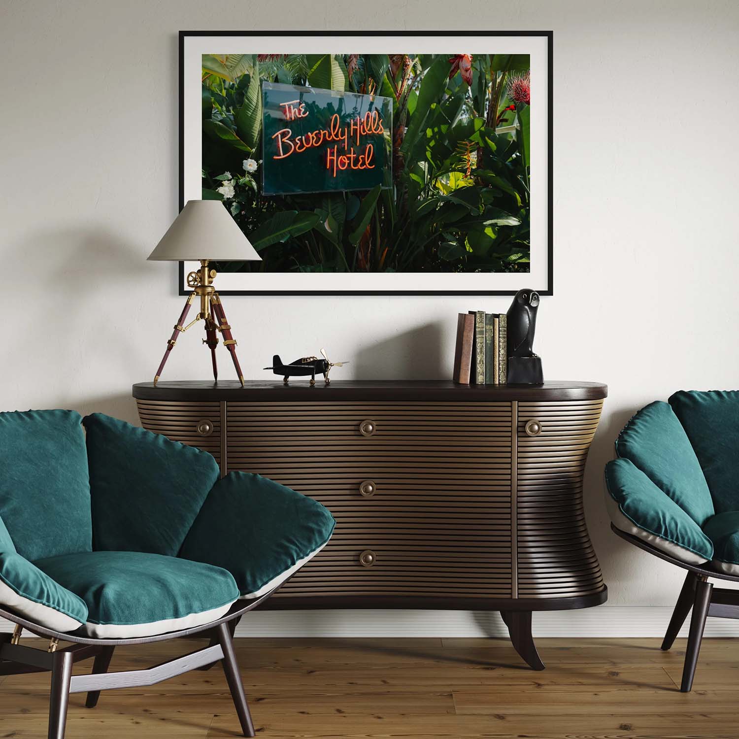 A framed photography print of the neon sign from the entrance to the Beverly Hills Hotel hangs on a wall in a mid-century modern entryway.