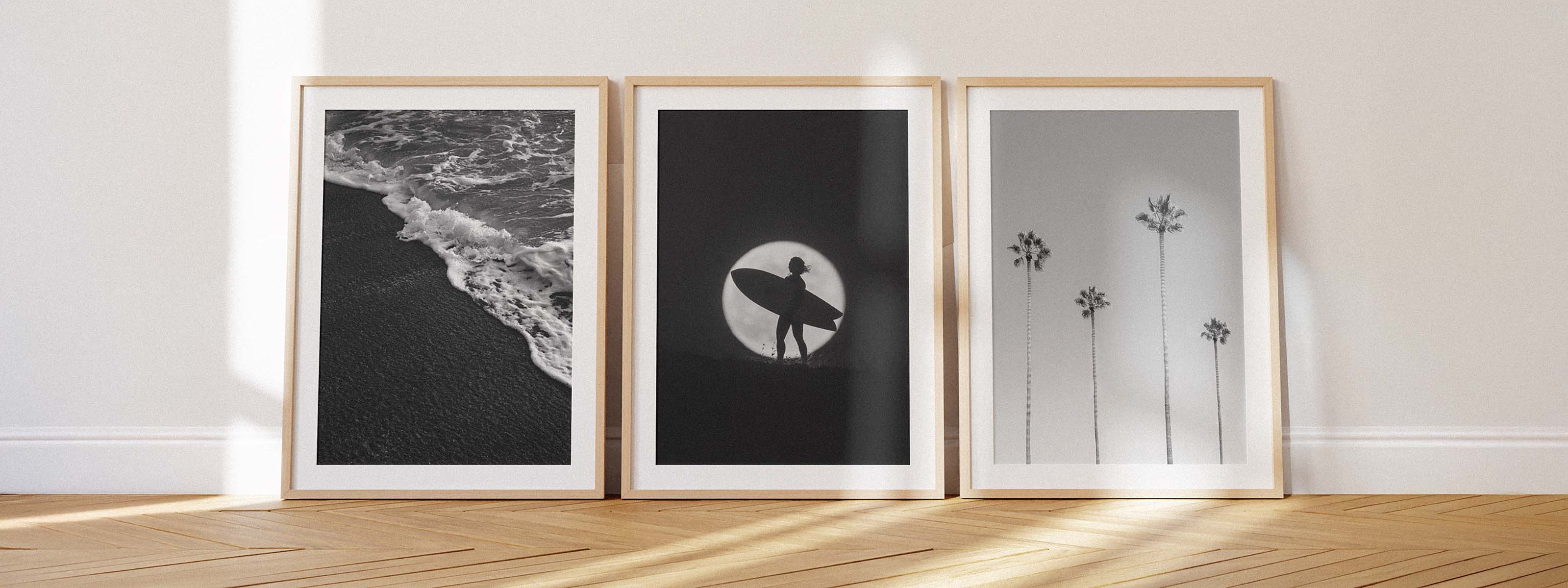 Three framed black and white coastal photography prints captured by Casey McCallister.