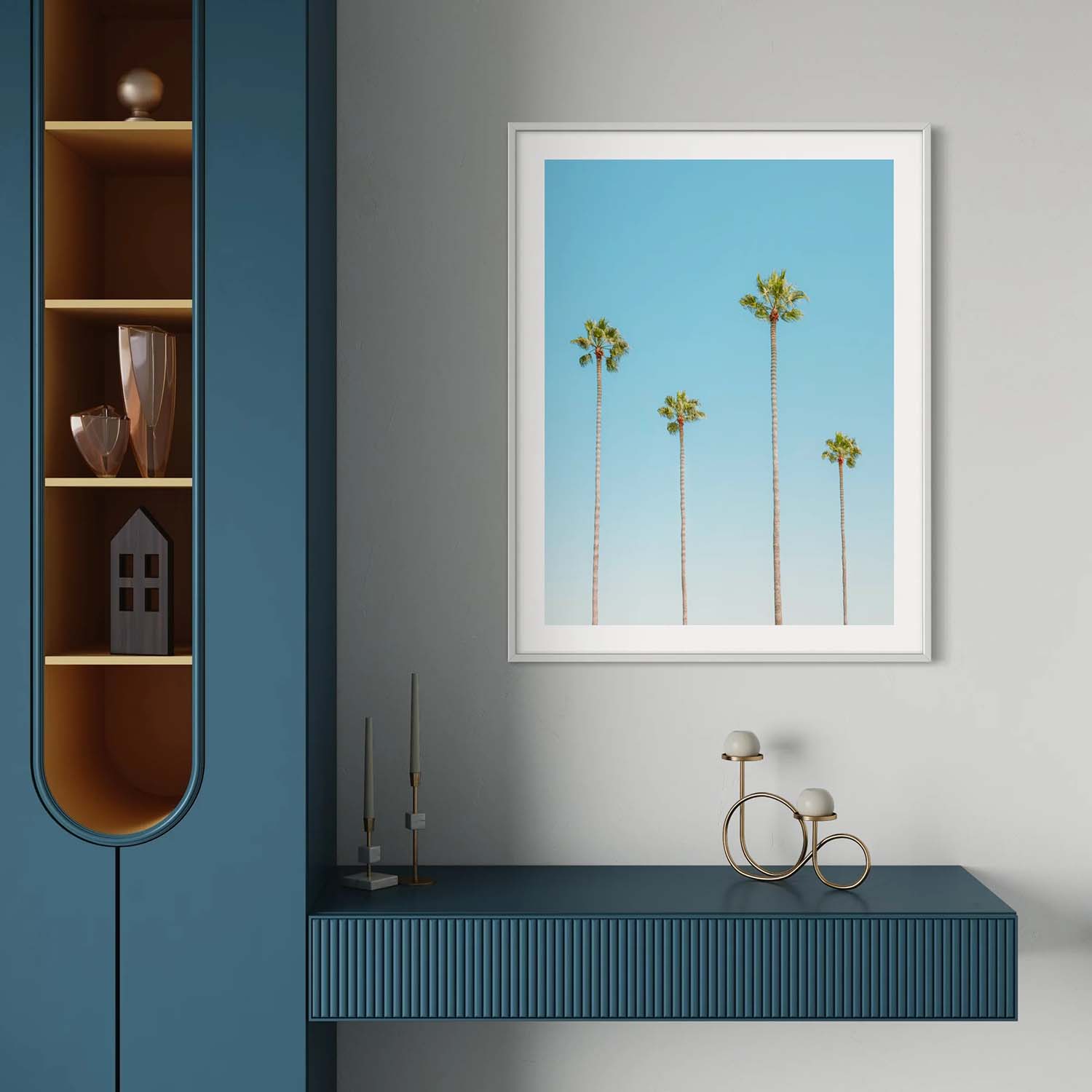 A framed photo of four palm trees hangs on the wall in a coastal-inspired foyer.