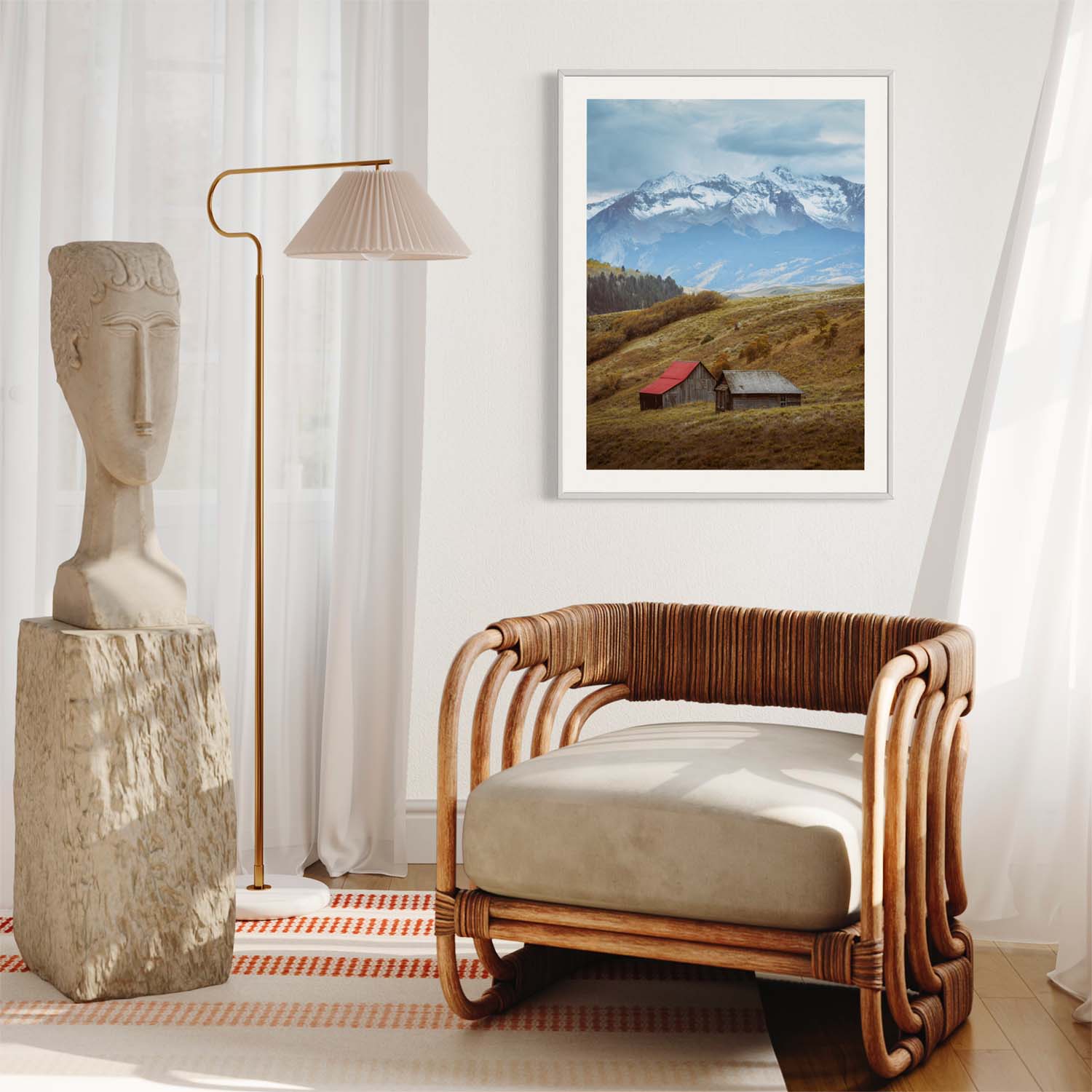 A photograph of barns outside of Telluride, Colorado hangs on a wall in a contemporary living room.