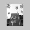 A black and white photograph of the exterior facade of the Beverly Hills Hotel in Southern California.