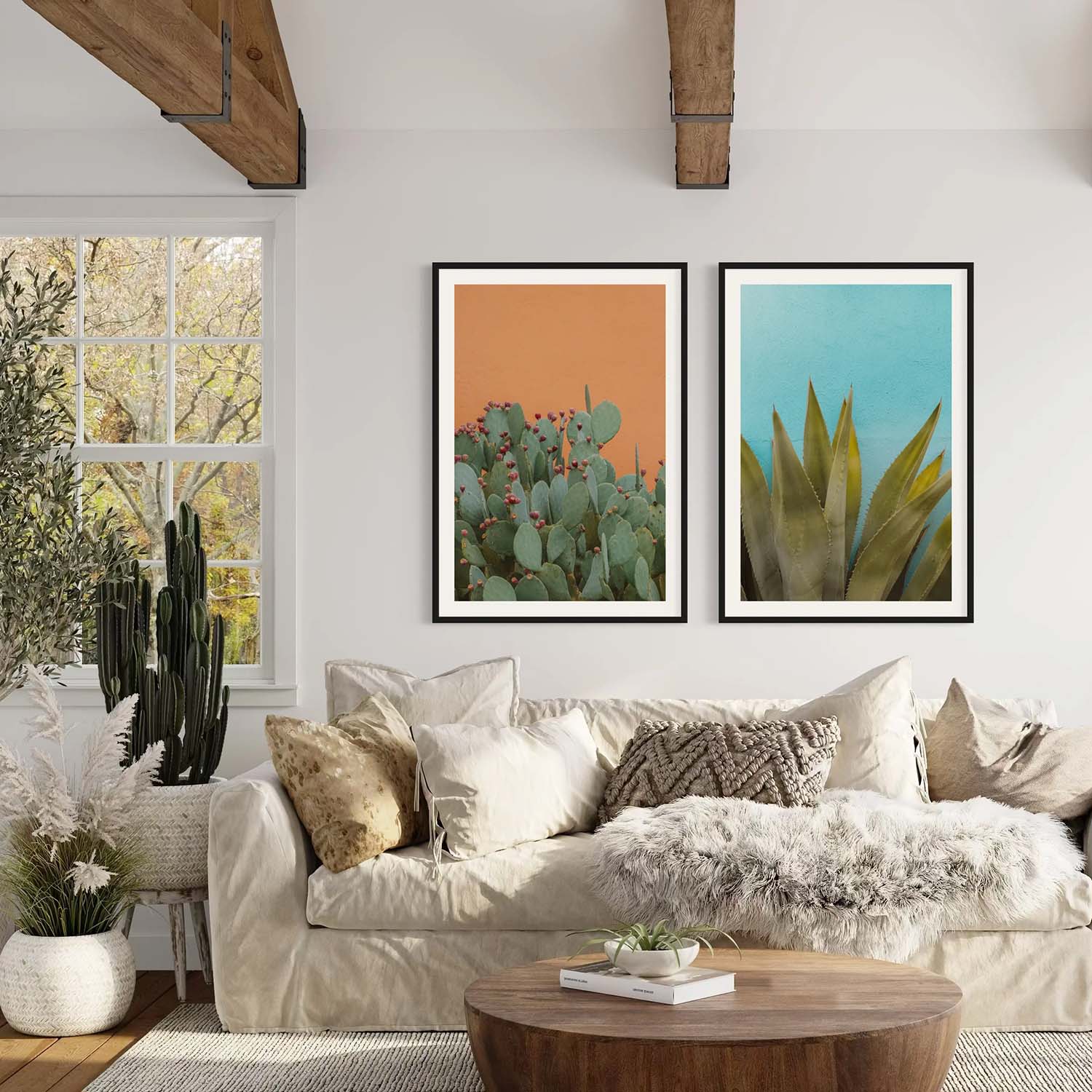 Diptych photographs of desert cactus hung on a wall in a southwestern-themed living room.