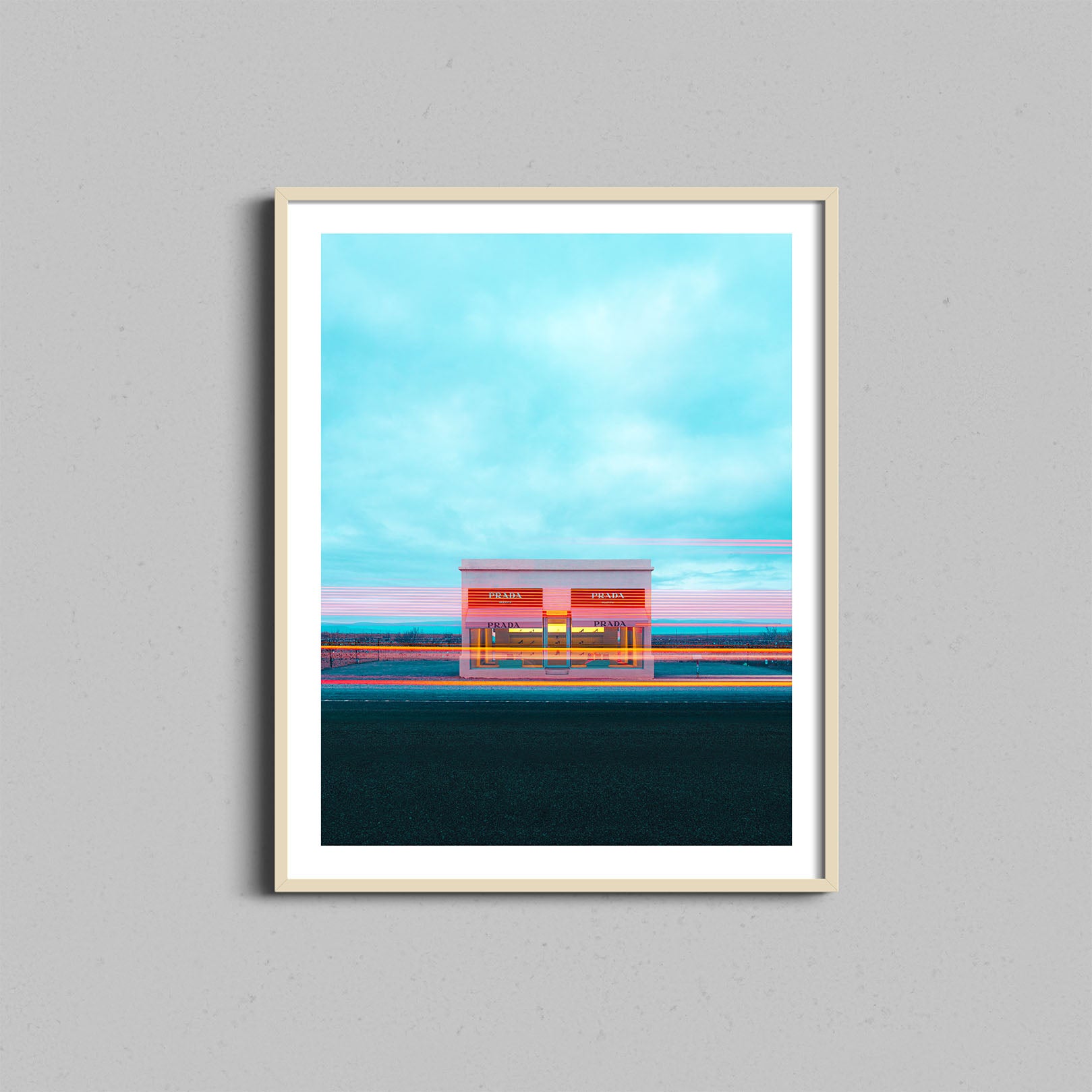 A photograph of the Prada Marfa art installation framed with a natural wooden frame.