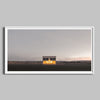 A panoramic photo of the Prada Marfa store framed in a modern white frame.