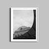 A black and white photograph of Denver Colorado's Union Station hanging in a white wooden frame.